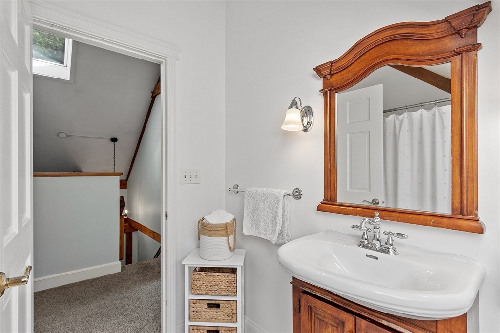 55 Carroll Road Grafton, MA 01536 - Photo 26 of 40 a bathroom with a sink and a mirror