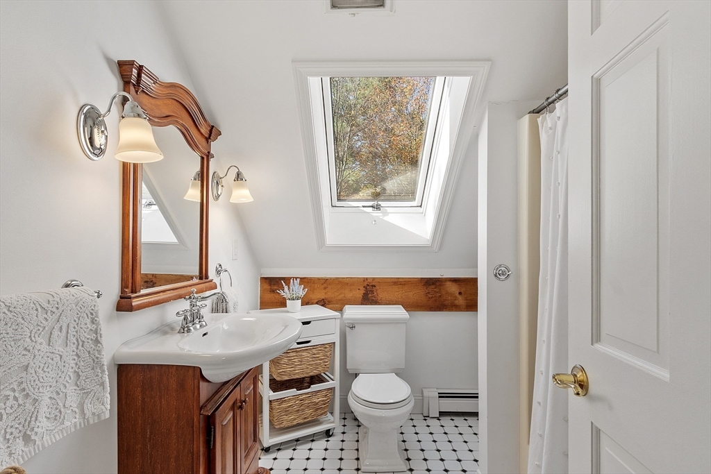 55 Carroll Road Grafton, MA 01536 - Photo 27 of 40 a bathroom with a sink toilet and mirror