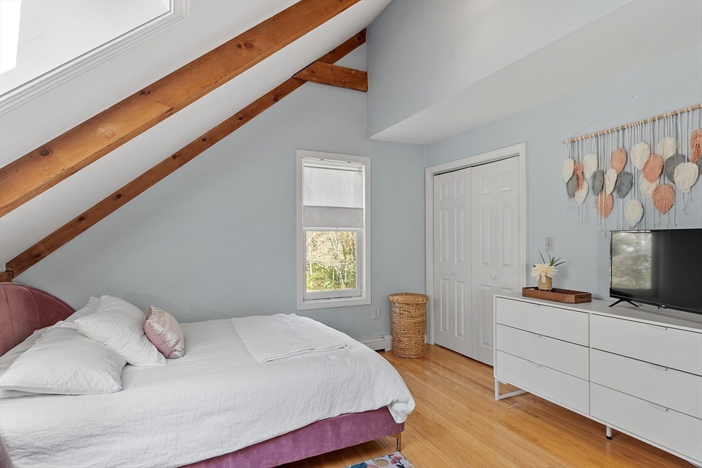 55 Carroll Road Grafton, MA 01536 - Photo 28 of 40 a bedroom with a bed and a window