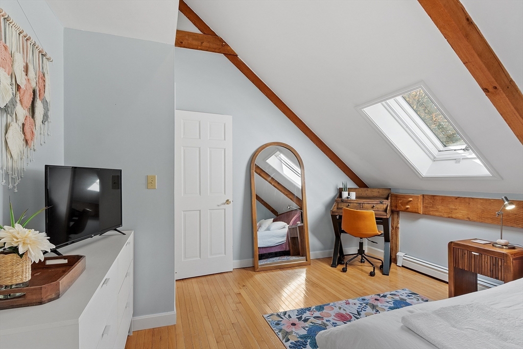 55 Carroll Road Grafton, MA 01536 - Photo 29 of 40 a living room with furniture and a flat screen tv