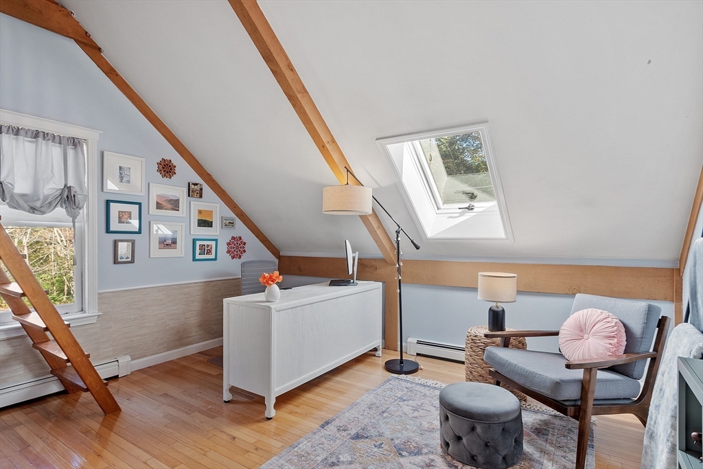 55 Carroll Road Grafton, MA 01536 - Photo 30 of 40 a living room with furniture and wooden floor