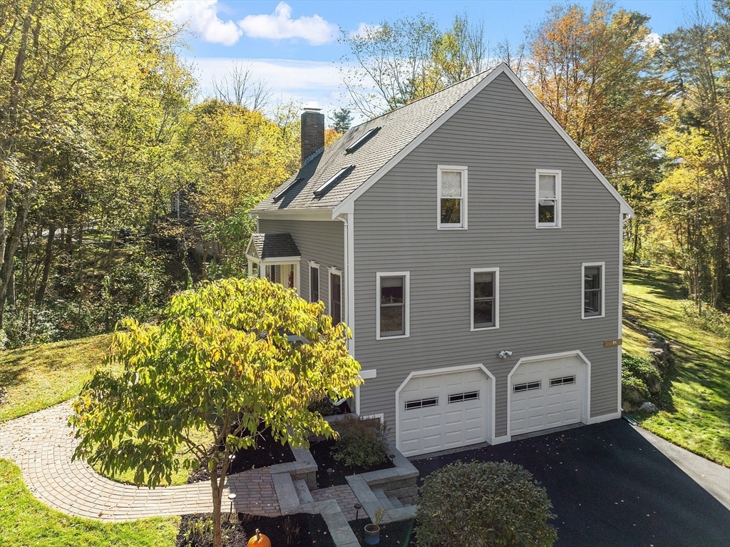55 Carroll Road Grafton, MA 01536 - Photo 34 of 40 a front view of a house with garden