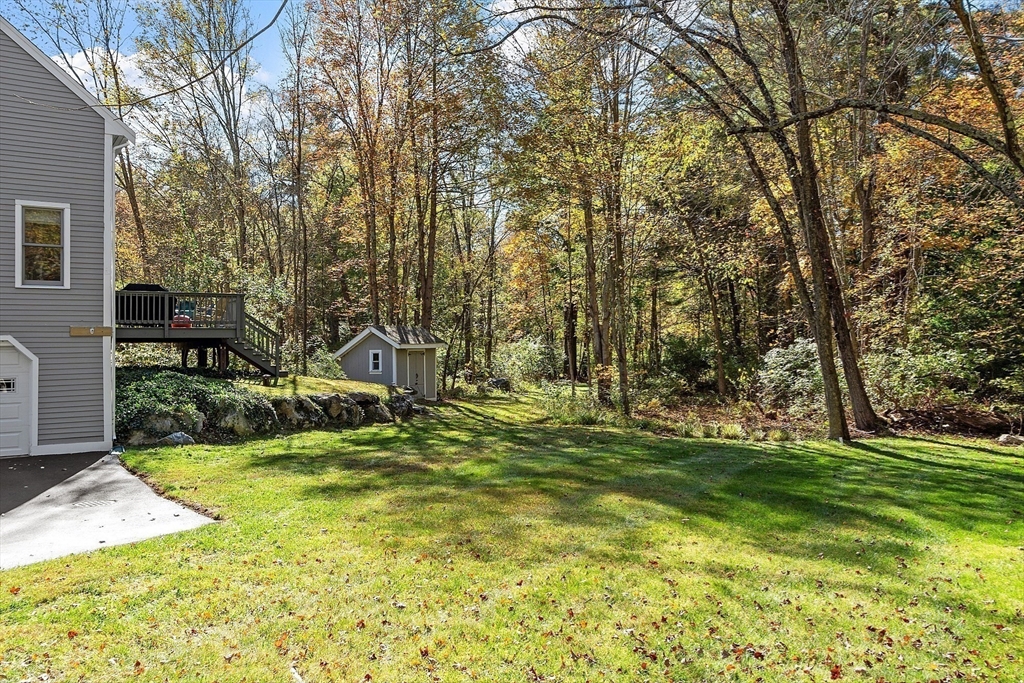 55 Carroll Road Grafton, MA 01536 - Photo 35 of 40 a view of a backyard with large trees
