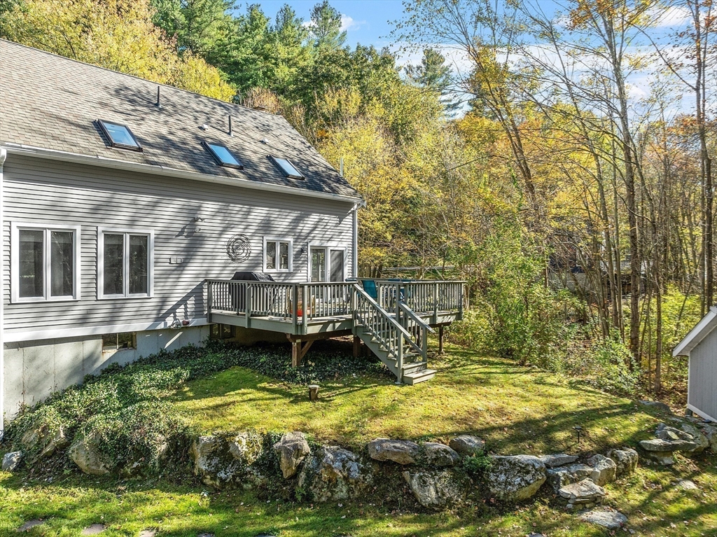 55 Carroll Road Grafton, MA 01536 - Photo 36 of 40 a view of a backyard with a small house