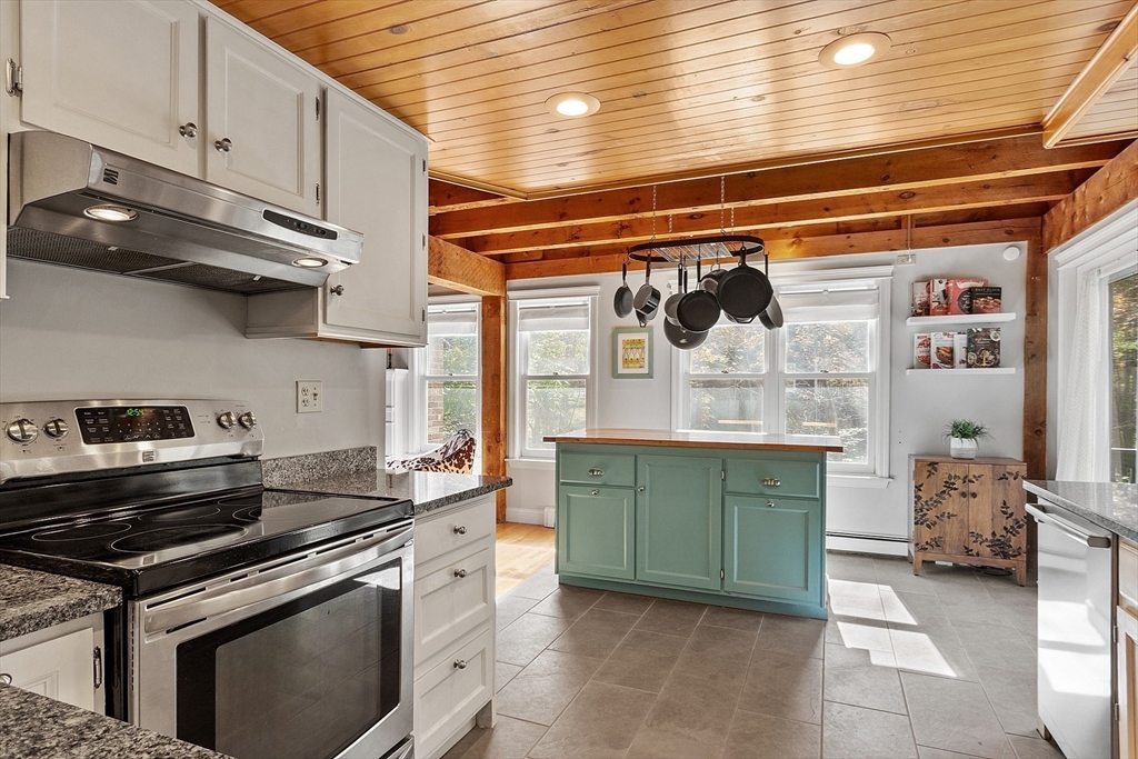 55 Carroll Road Grafton, MA 01536 - Photo 5 of 40 a kitchen with a stove and cabinets
