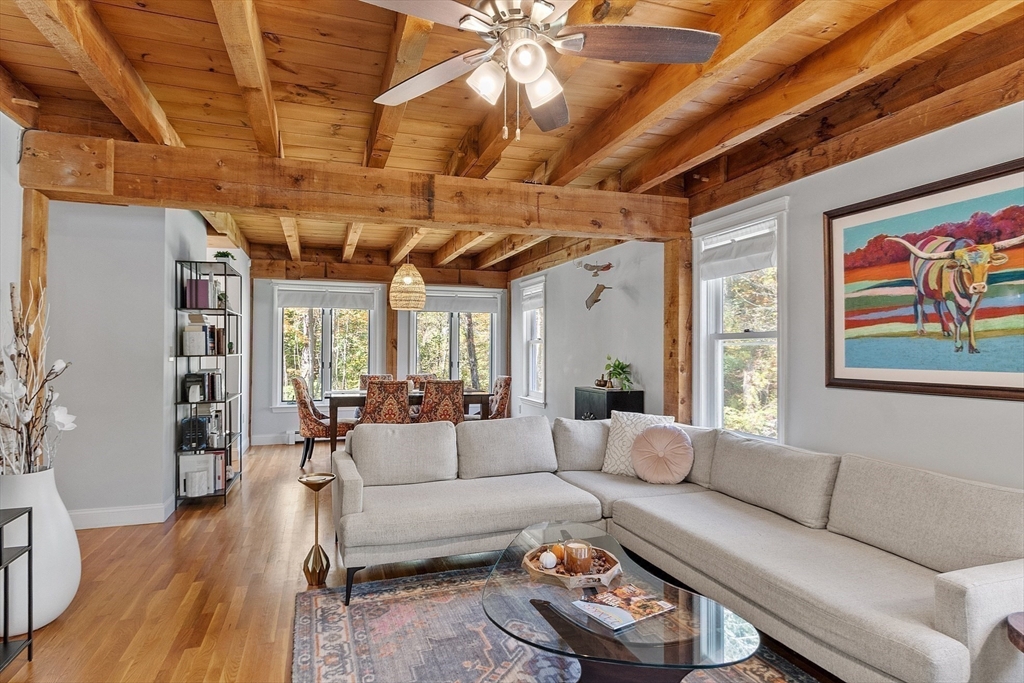 55 Carroll Road Grafton, MA 01536 - Photo 10 of 40 a living room with furniture a ceiling fan and a rug