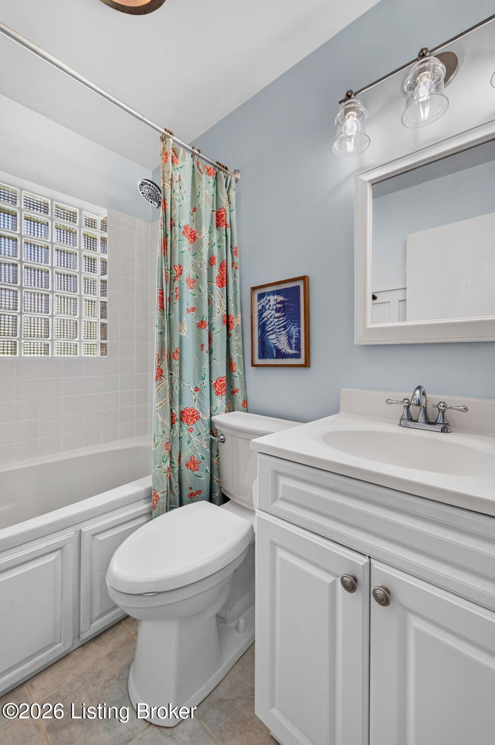 2104 North Rose Island Road Prospect, KY 40059 - Photo 34 of 57 A single vanity with storage is paired with a mirrored medicine cabinet above