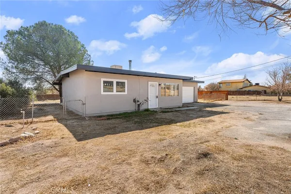 a view of backyard of a house