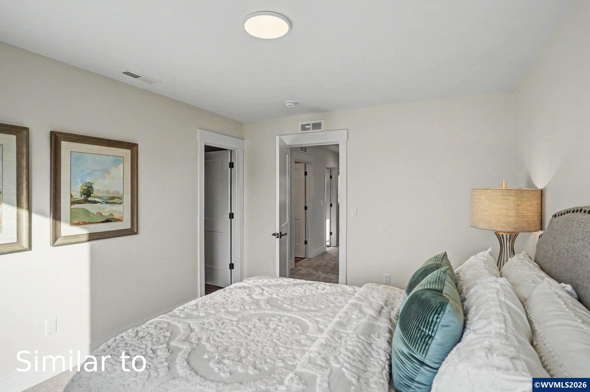 2550 Promise Way Lebanon, OR 97355 - Photo 20 of 35 a bedroom with a bed and a painting on the wall