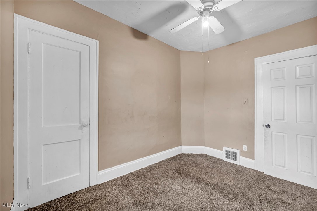 949 Rudyard Road Cleveland, OH 44110 - Photo 23 of 42 Empty room featuring carpet and ceiling fan
