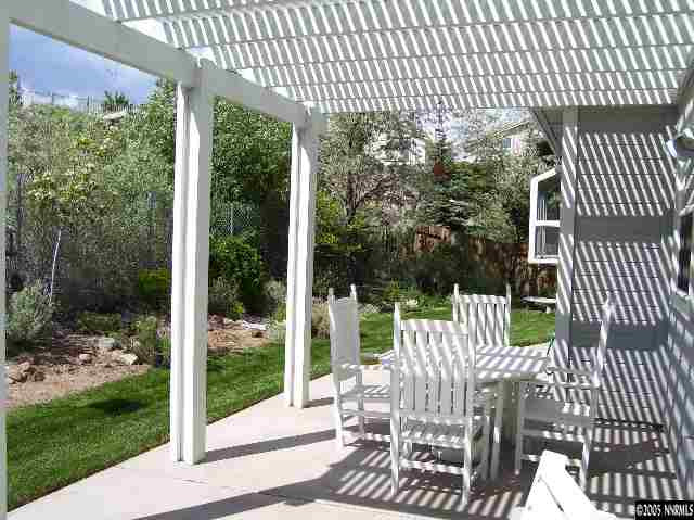 2287 Ridgeview Drive Reno, NV 89519 - Photo 2 of 9 a view of a patio with a table chairs and backyard