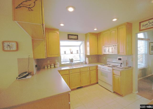 2287 Ridgeview Drive Reno, NV 89519 - Photo 6 of 9 a large kitchen with a lot of counter space and a sink