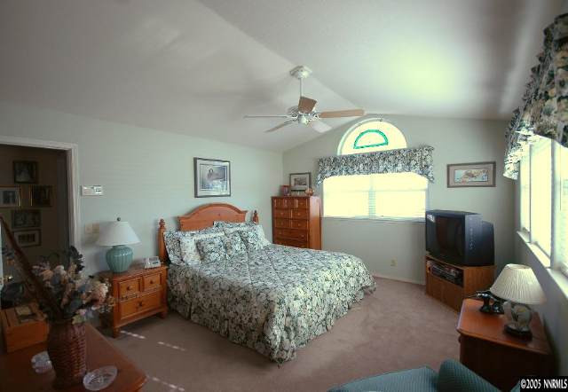 2287 Ridgeview Drive Reno, NV 89519 - Photo 8 of 9 a bedroom with furniture and a window