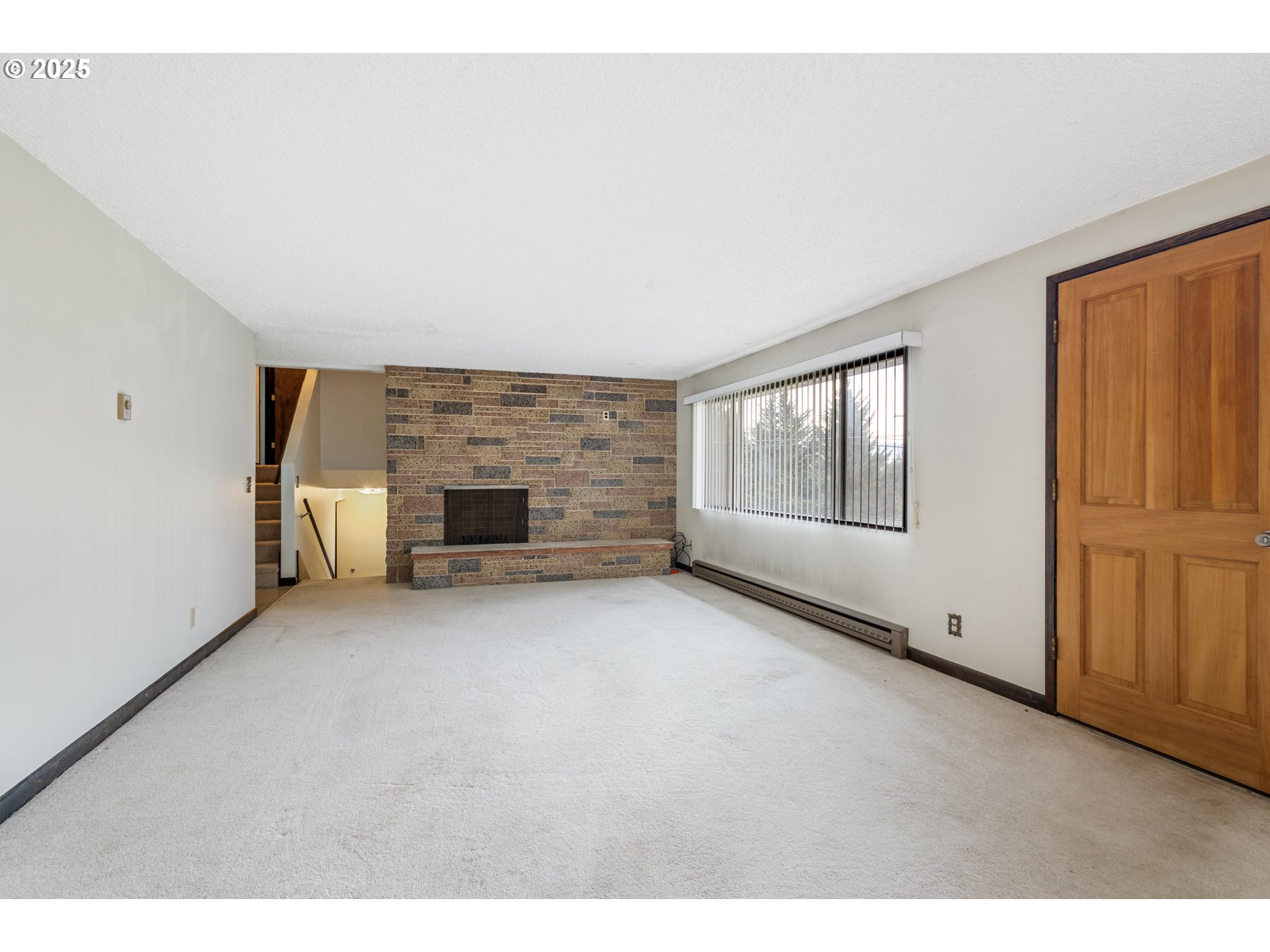 5673 Southwest Old Highway 47 Gaston, OR 97119 - Photo 13 of 33 a view of an empty room with a fireplace
