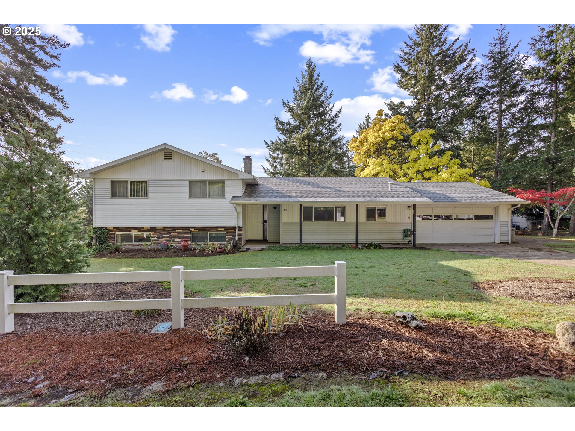5673 Southwest Old Highway 47 Gaston, OR 97119 - Photo 2 of 33 a front view of a house with a yard