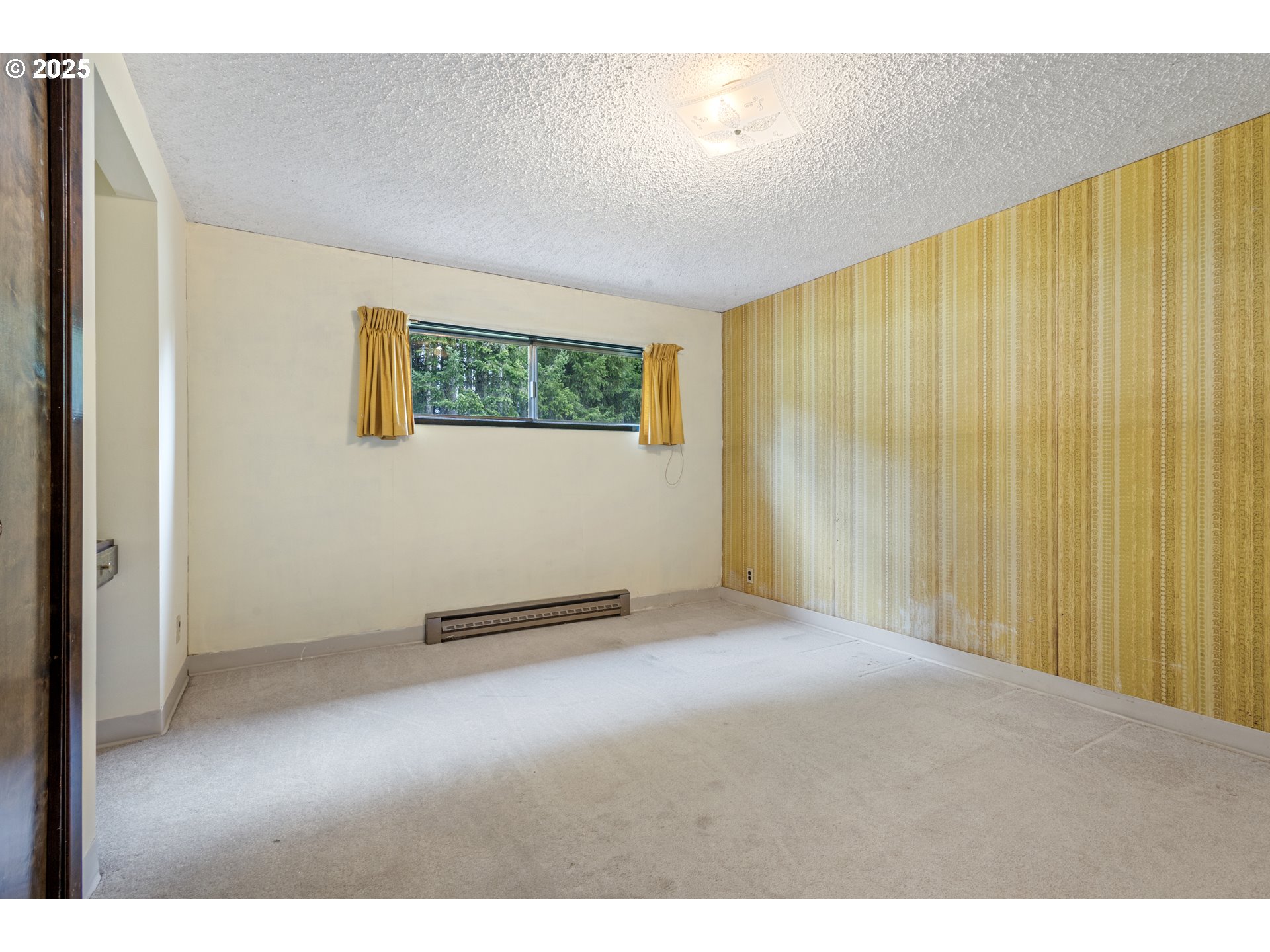 5673 Southwest Old Highway 47 Gaston, OR 97119 - Photo 22 of 33 a view of an empty room with wooden floor