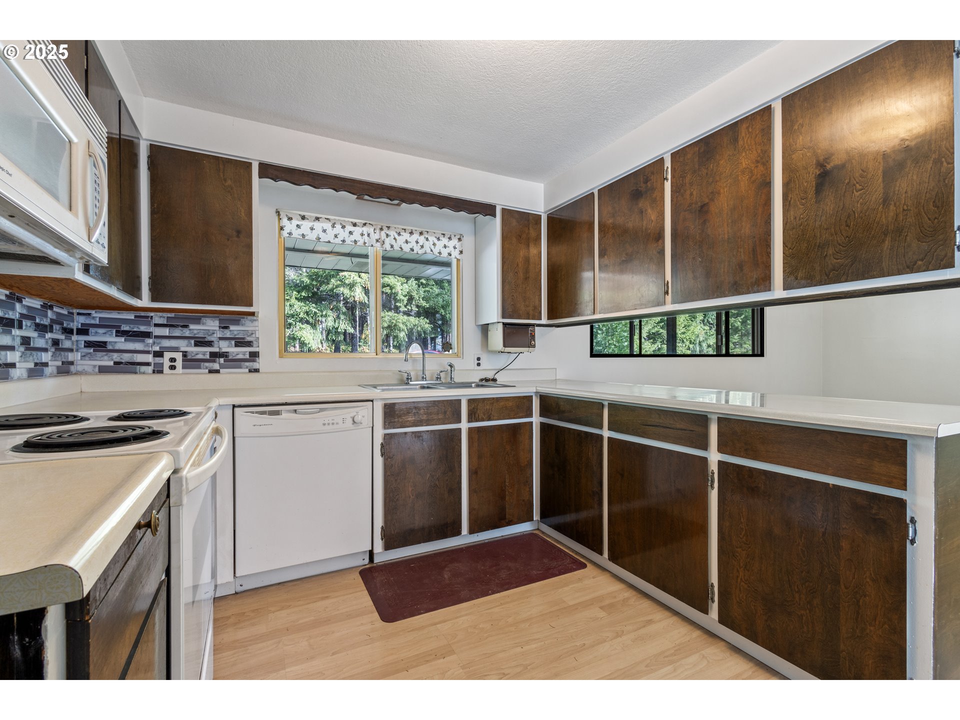 5673 Southwest Old Highway 47 Gaston, OR 97119 - Photo 31 of 33 a kitchen with a sink and large window
