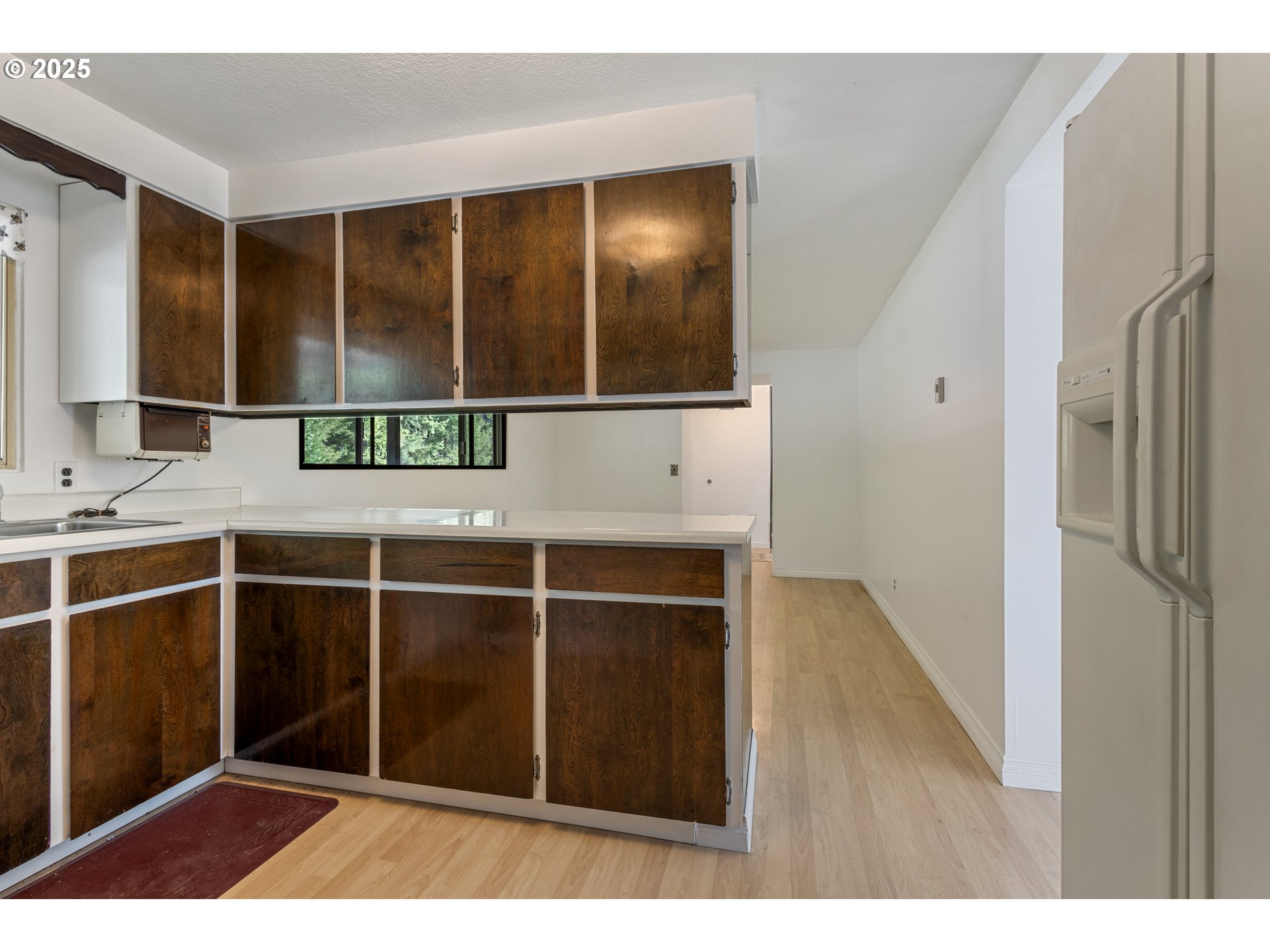 5673 Southwest Old Highway 47 Gaston, OR 97119 - Photo 33 of 33 a room with a window and wooden floor