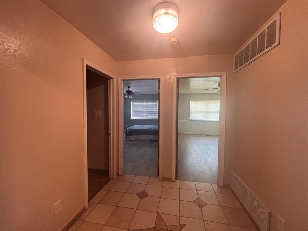 5355 Banks Road Fort Worth, TX 76140 - Photo 4 of 29 an empty room with closet and wooden floor