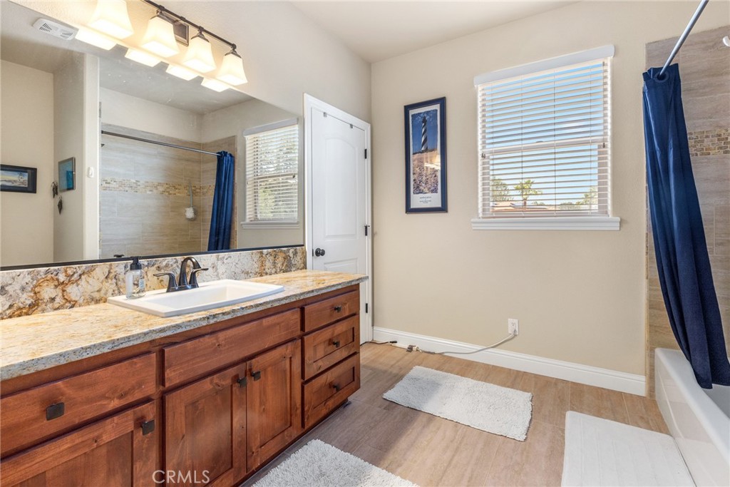 3265 Siena Ridge Loop Chico, CA 95928 - Photo 16 of 19 a bathroom with a double vanity sink and a mirror