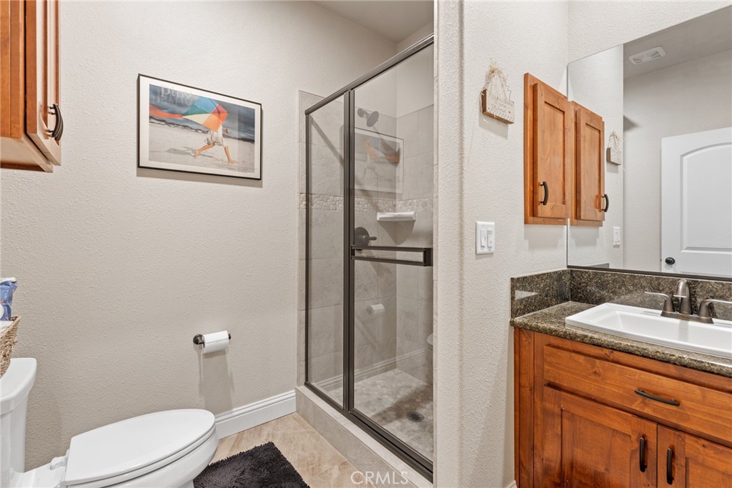 3265 Siena Ridge Loop Chico, CA 95928 - Photo 17 of 19 a bathroom with a sink a toilet and shower
