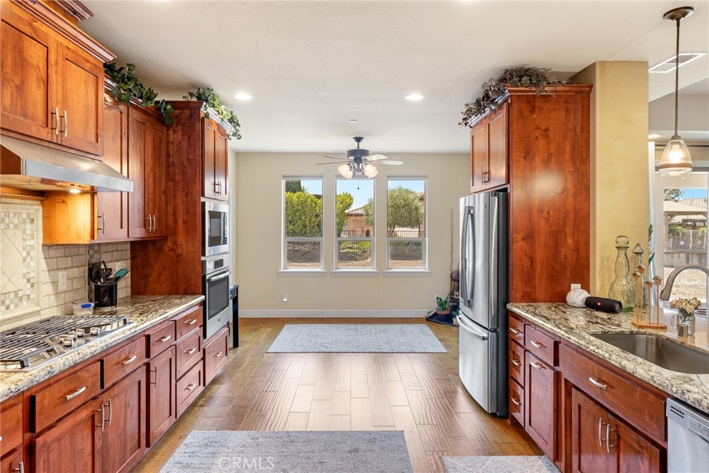 3265 Siena Ridge Loop Chico, CA 95928 - Photo 8 of 19 a bathroom with a double vanity sink a large mirror and a bathtub