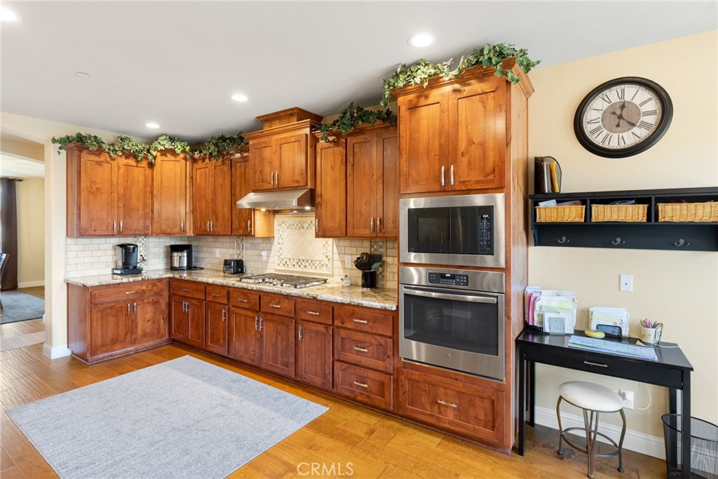 3265 Siena Ridge Loop Chico, CA 95928 - Photo 9 of 19 a kitchen with a refrigerator a stove top oven a sink and cabinets