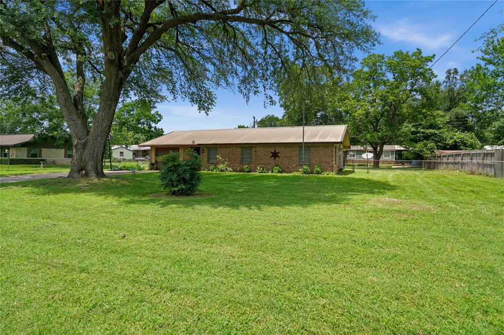 6753 Murphy Street Murchison, TX 75778 - Photo 1 of 24 a view of a house with a backyard