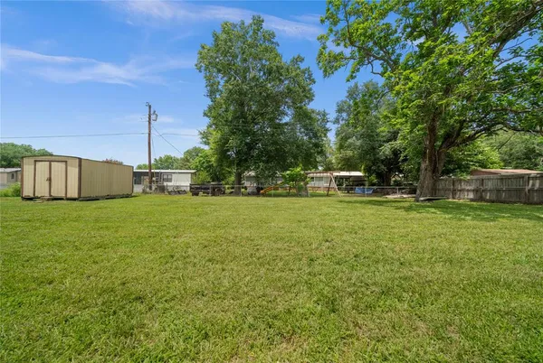 a view of a house with a big yard