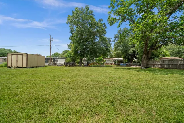 a view of a house with a big yard