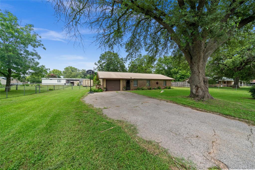 6753 Murphy Street Murchison, TX 75778 - Photo 2 of 24 a front view of house with yard and green space