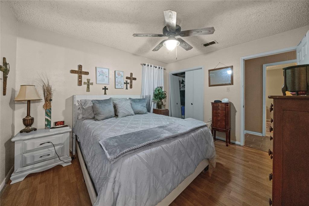 6753 Murphy Street Murchison, TX 75778 - Photo 10 of 24 a bed room with a bed and a tv