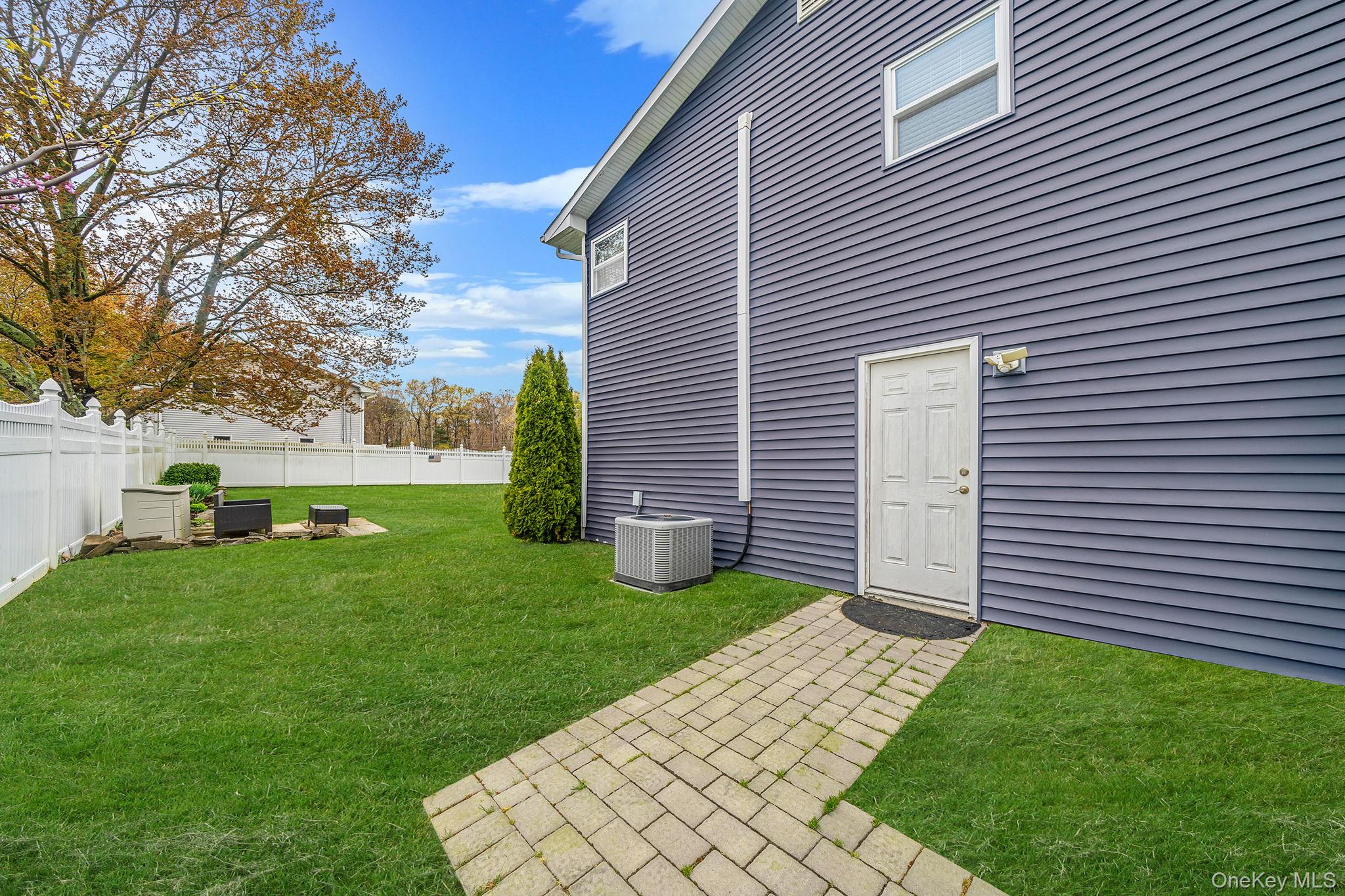 110 Stephen Road Bayport, NY 11705 - Photo 4 of 39 a view of a backyard with a garden