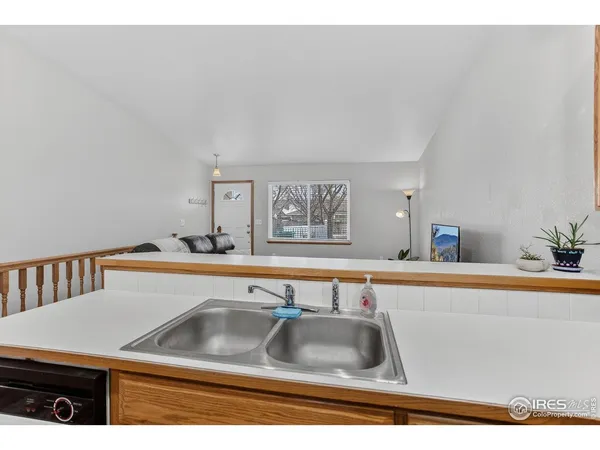 a kitchen with a sink and a refrigerator