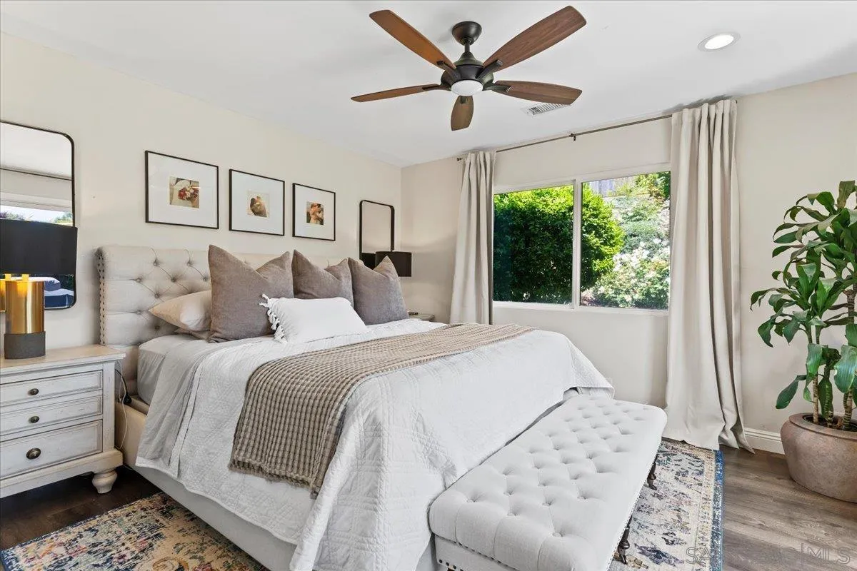 12243 Buckskin Trail Poway, CA 92064 - Photo 31 of 41 a bedroom with a large bed and a window