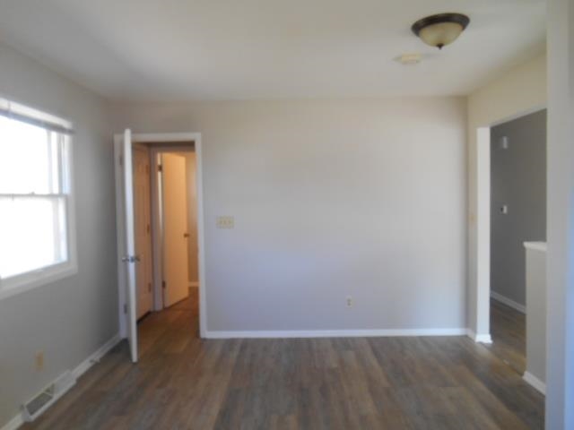 1908 Ridgeland Road Rockford, IL 61108 - Photo 10 of 20 an empty room with wooden floor and windows
