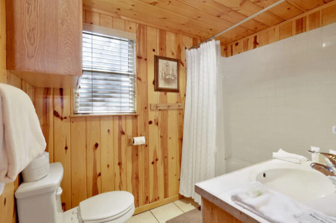 39187 Arapahoe Road Fawnskin, CA 92333 - Photo 9 of 18 a bathroom with a sink toilet and shower