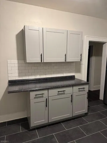 a kitchen with appliances cabinets and a sink