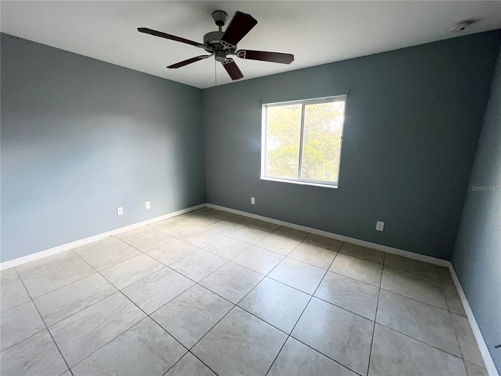 3281 Easy Street Port Charlotte, FL 33952 - Photo 7 of 8 a view of an empty room with a window