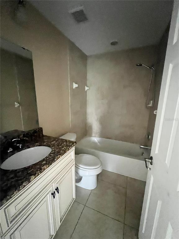 3281 Easy Street Port Charlotte, FL 33952 - Photo 8 of 8 a bathroom with a granite countertop sink toilet and shower