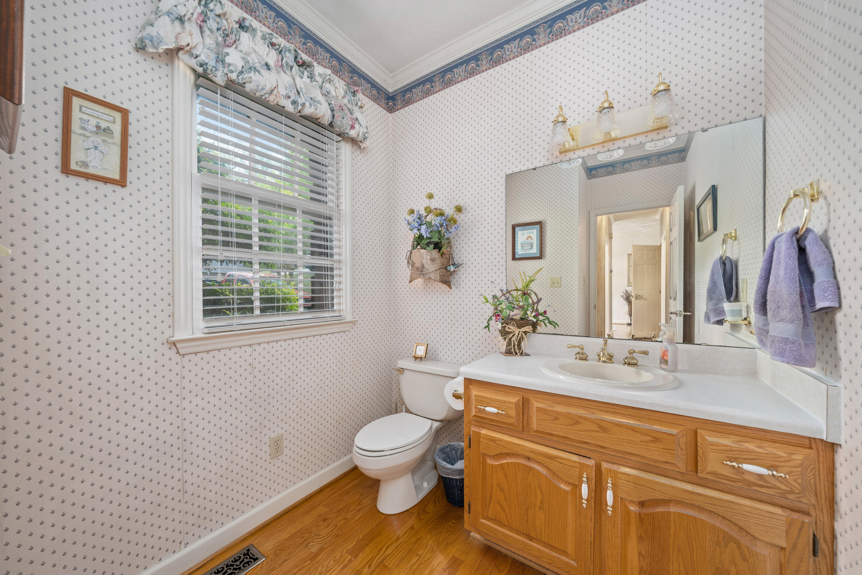 480 Downing Street Roanoke, VA 24019 - Photo 12 of 29 a bathroom with a granite countertop toilet sink and mirror