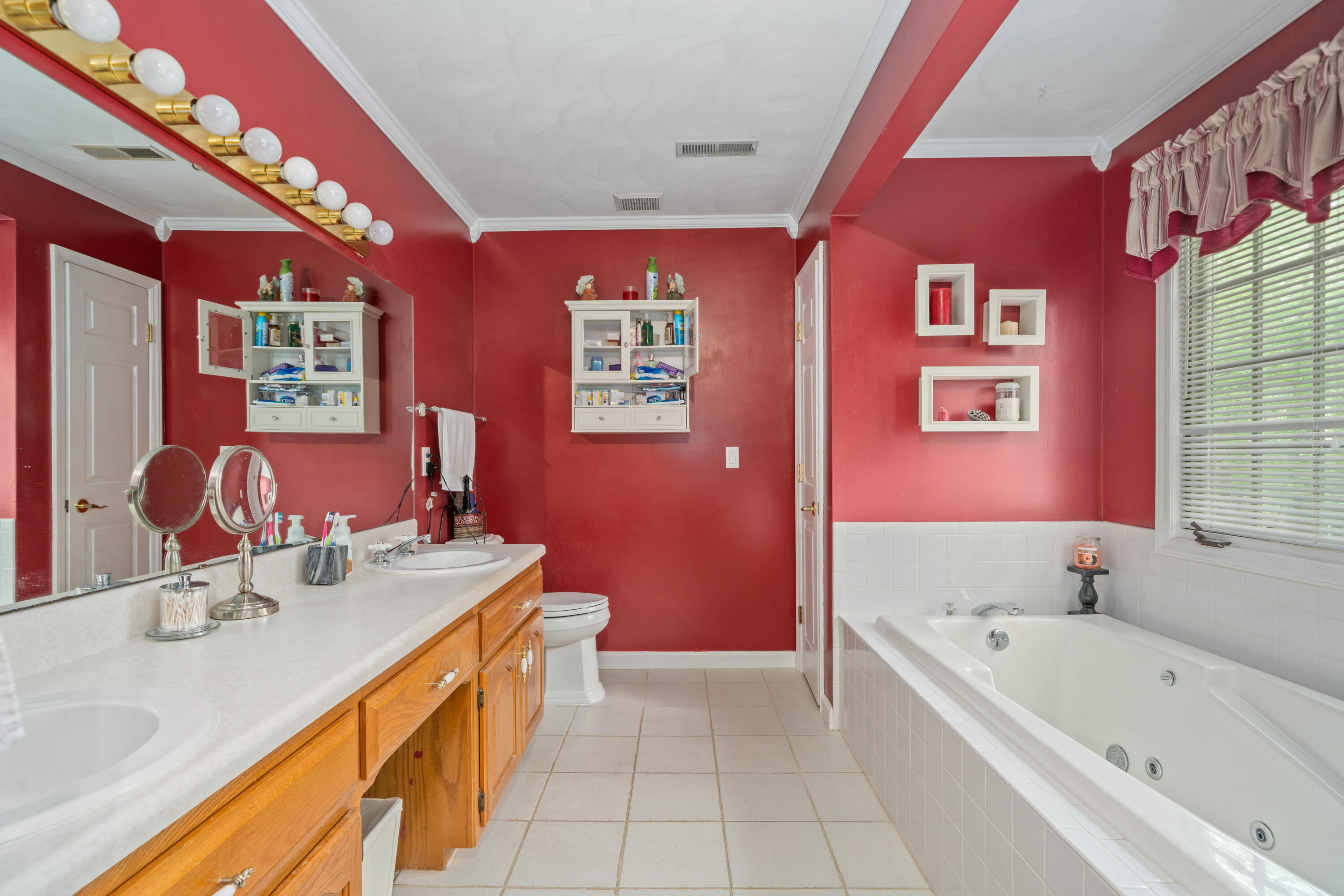 480 Downing Street Roanoke, VA 24019 - Photo 14 of 29 a bathroom with a tub double vanity sink and mirror