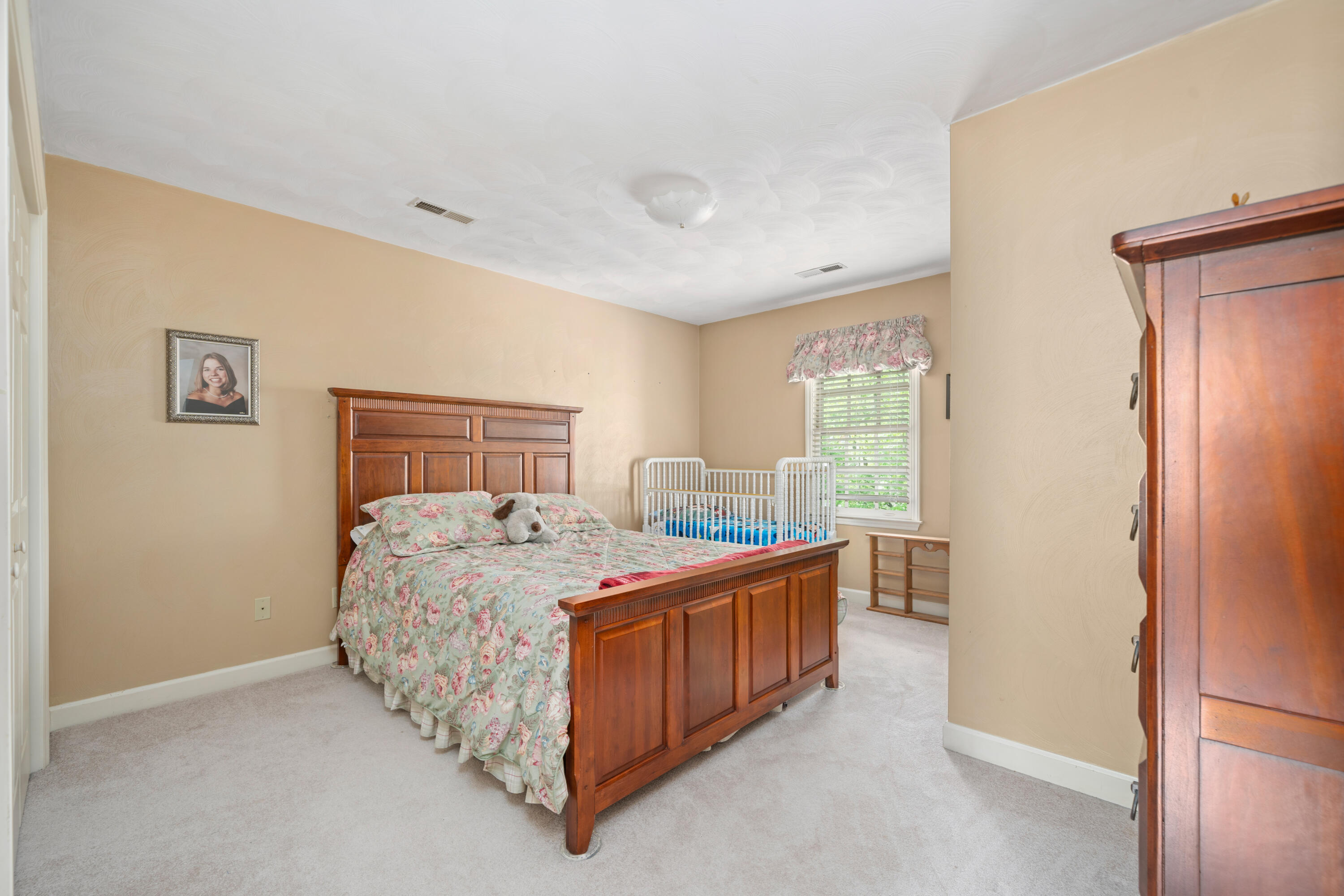 480 Downing Street Roanoke, VA 24019 - Photo 15 of 29 a bed room with a bed and a window