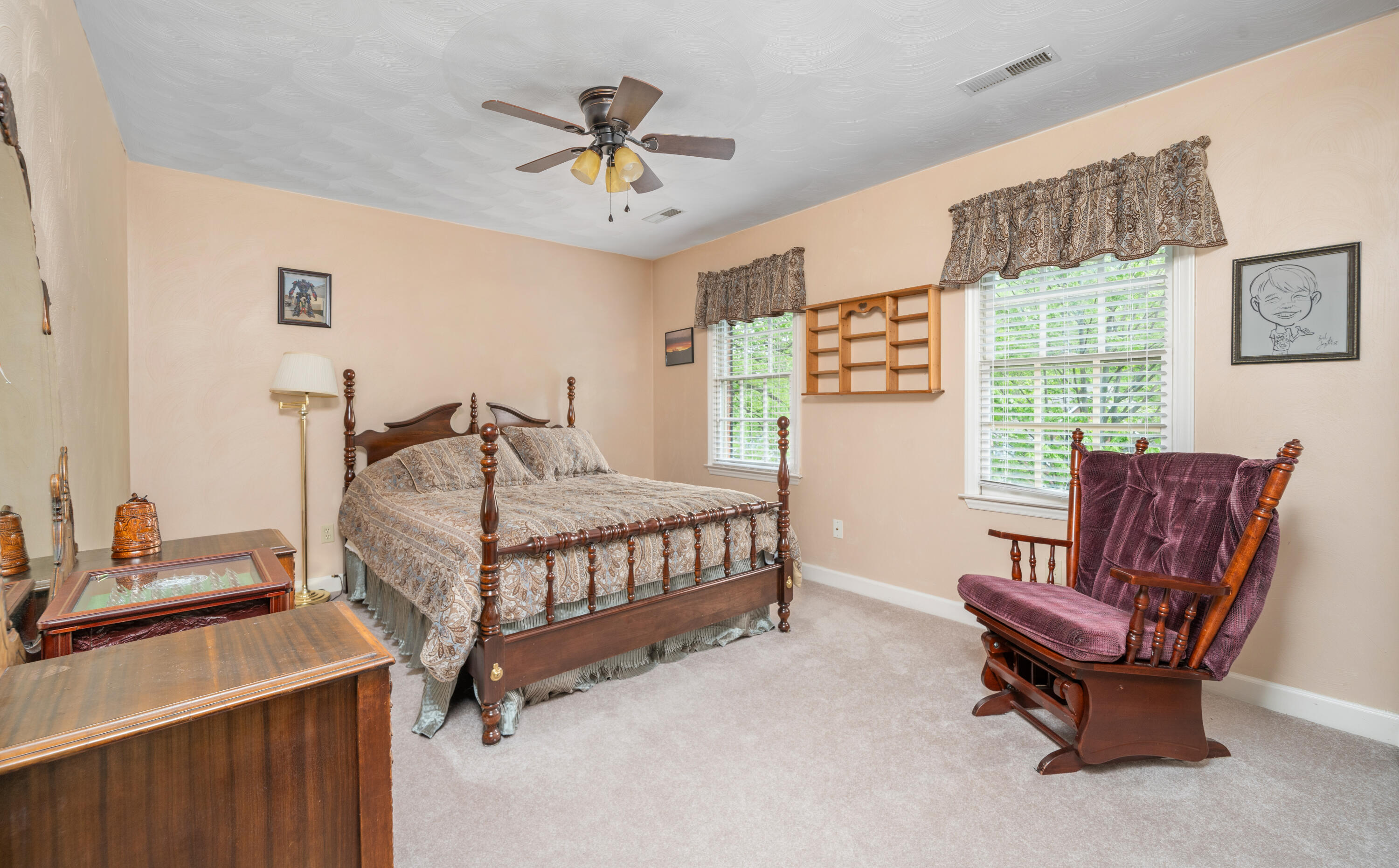480 Downing Street Roanoke, VA 24019 - Photo 18 of 29 a bedroom with a bed and a chandelier