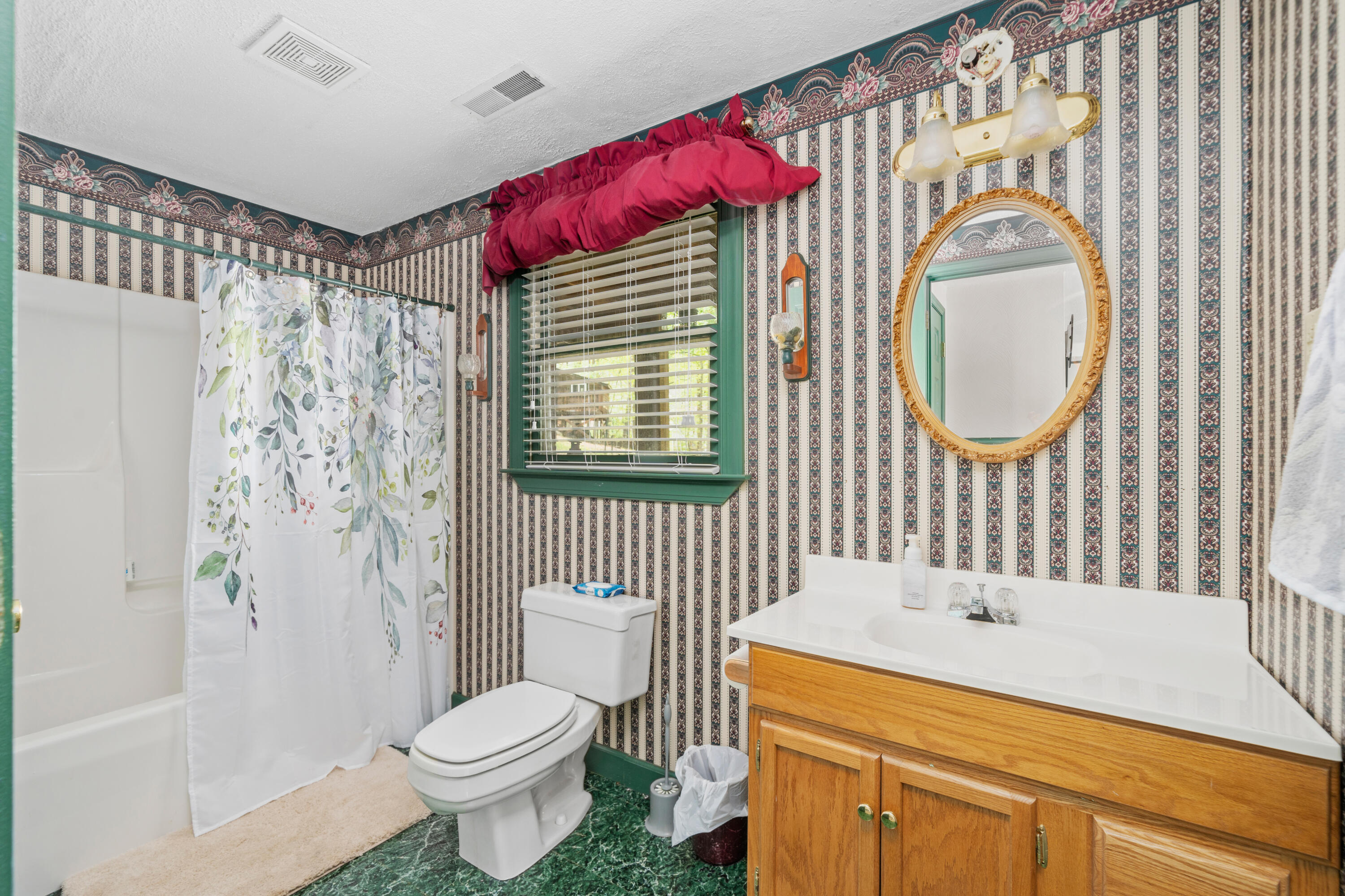 480 Downing Street Roanoke, VA 24019 - Photo 22 of 29 a bathroom with a sink toilet and shower