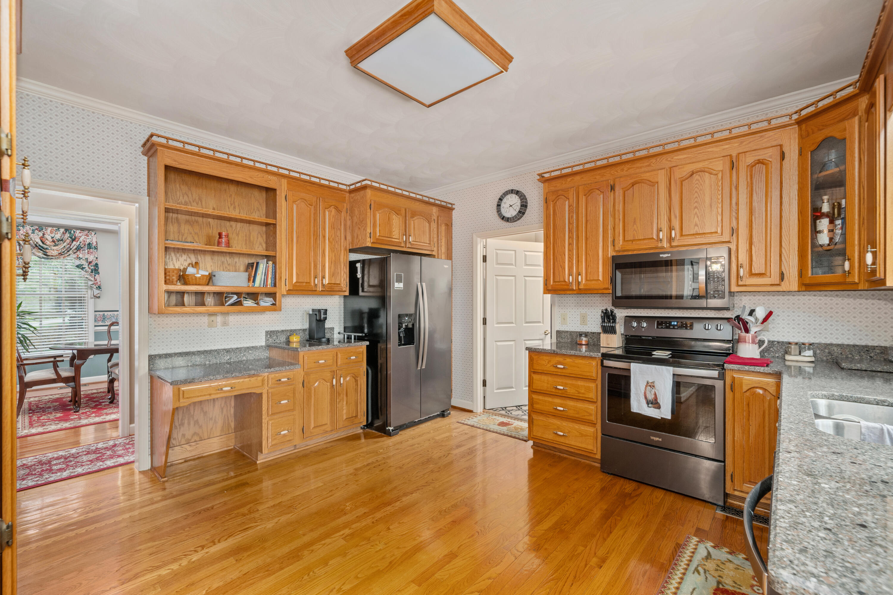 480 Downing Street Roanoke, VA 24019 - Photo 7 of 29 a kitchen with stainless steel appliances granite countertop a refrigerator stove top oven and sink