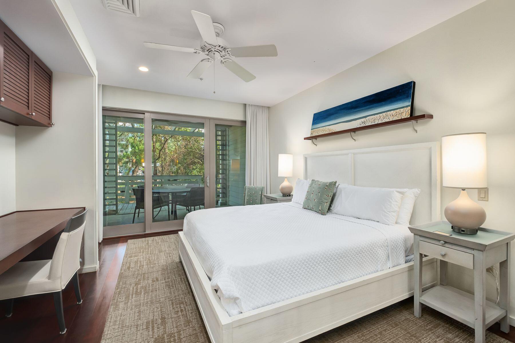 29 Goldenrod Circle, Unit 3018 Santa Rosa Beach, FL 32459 - Photo 11 of 22 a bedroom with a large bed and a chandelier