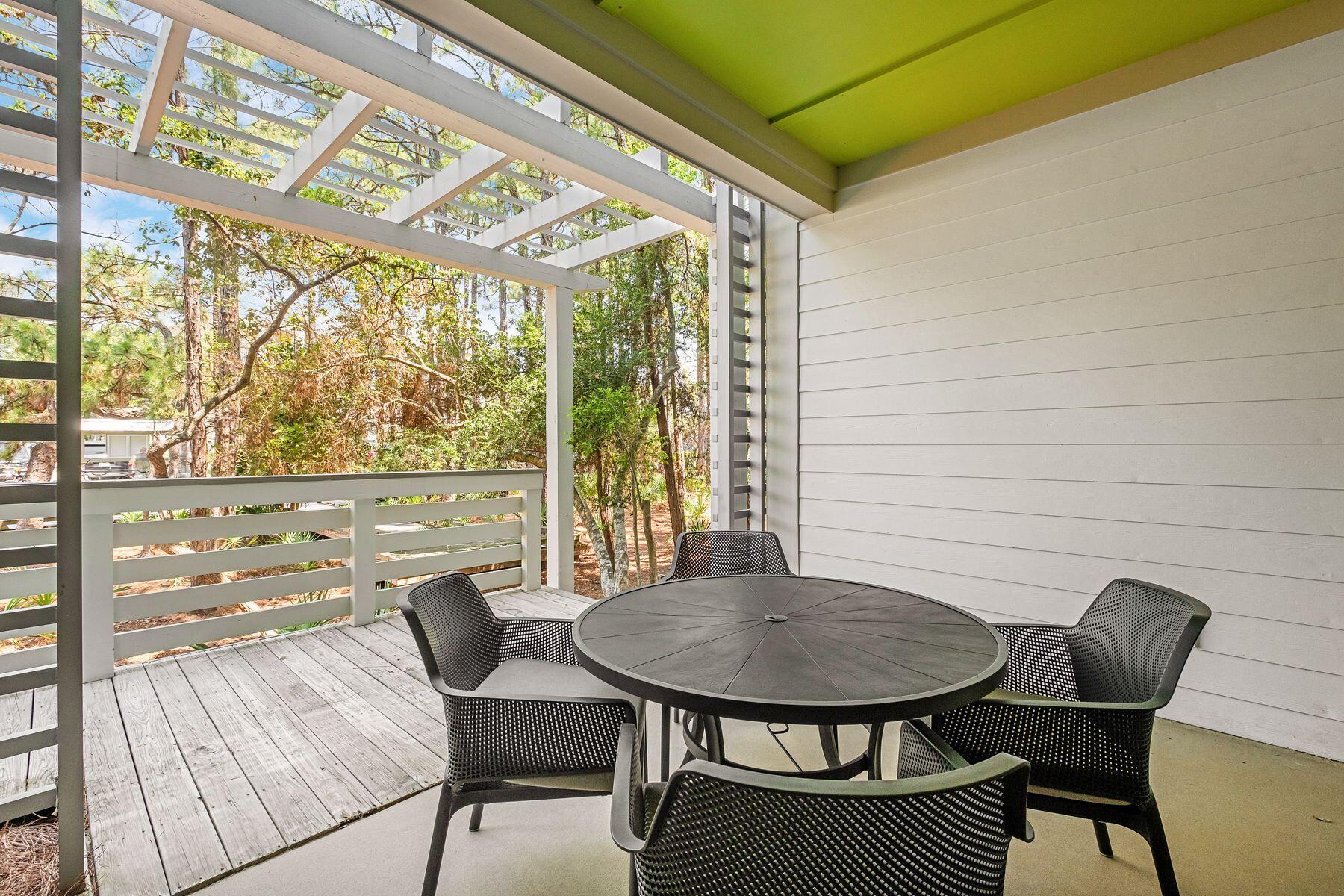 29 Goldenrod Circle, Unit 3018 Santa Rosa Beach, FL 32459 - Photo 9 of 22 a view of a outdoor space with a table and chairs
