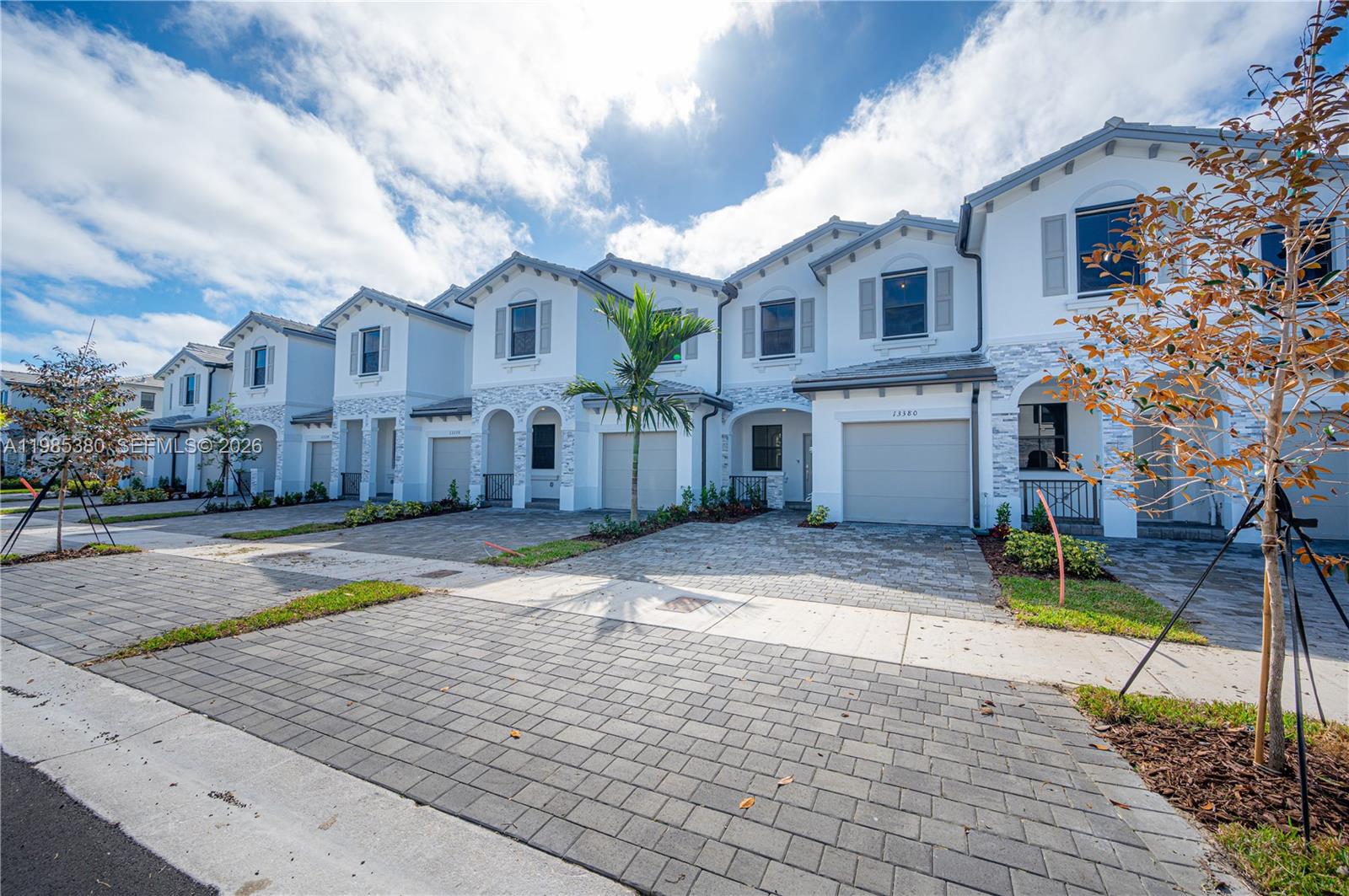 13380 Southwest 287th Terrace Homestead, FL 33033 - Photo 3 of 21 a view of a white house with a yard and sitting area