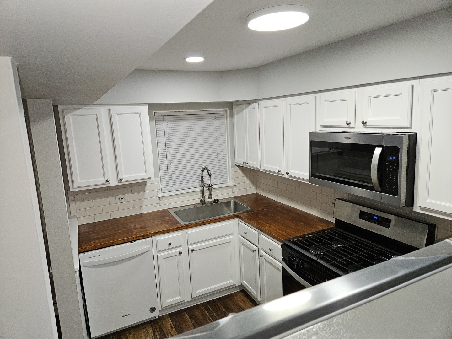 2348 West 111th Street, Unit 2 Chicago, IL 60643 - Photo 11 of 23 a kitchen with granite countertop a stove and a sink